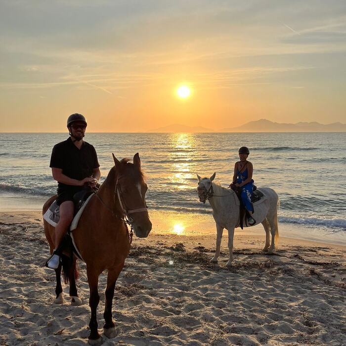 Sunset horse ride by the sea